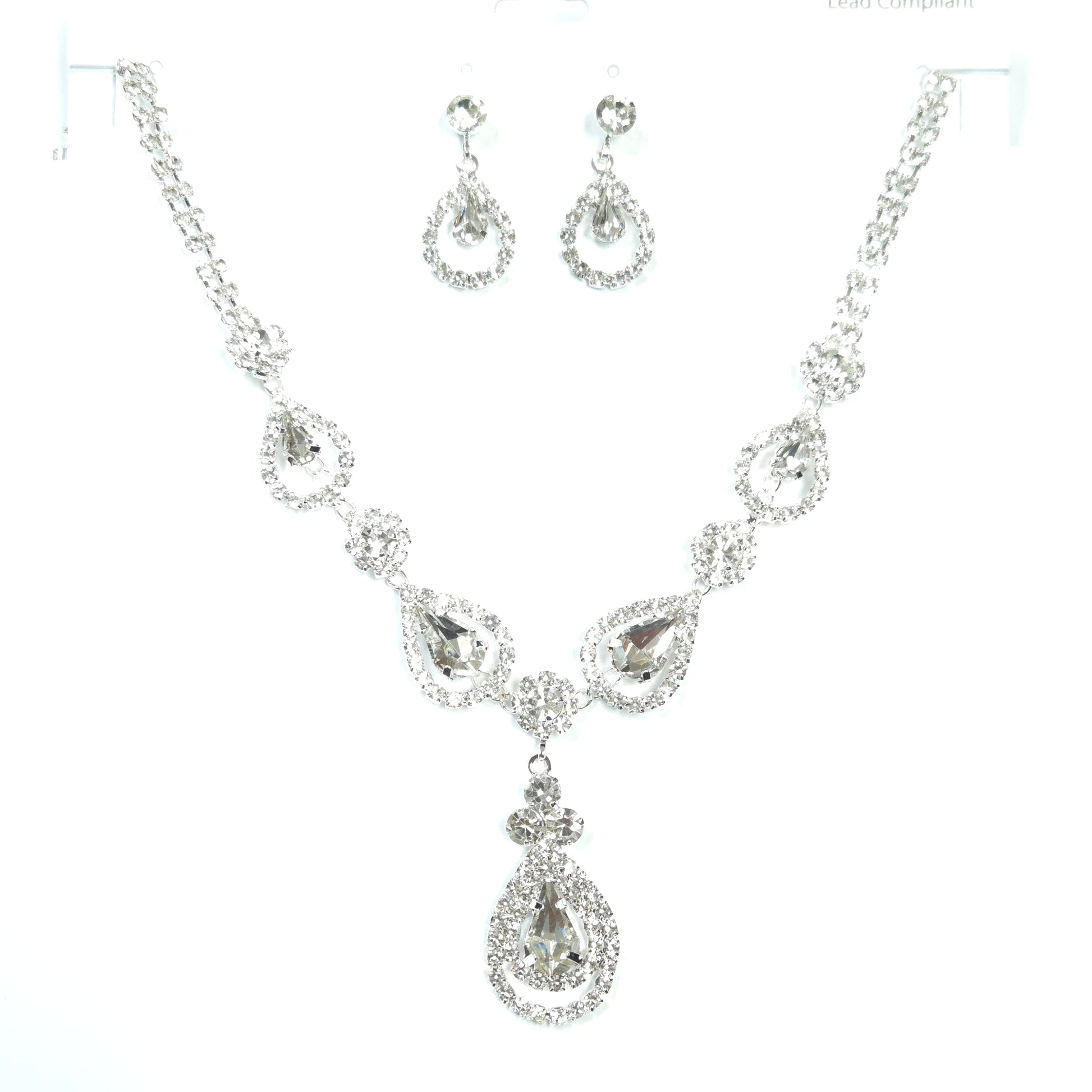 Silver jewelry set with necklace, bracelet, and earrings on a white background