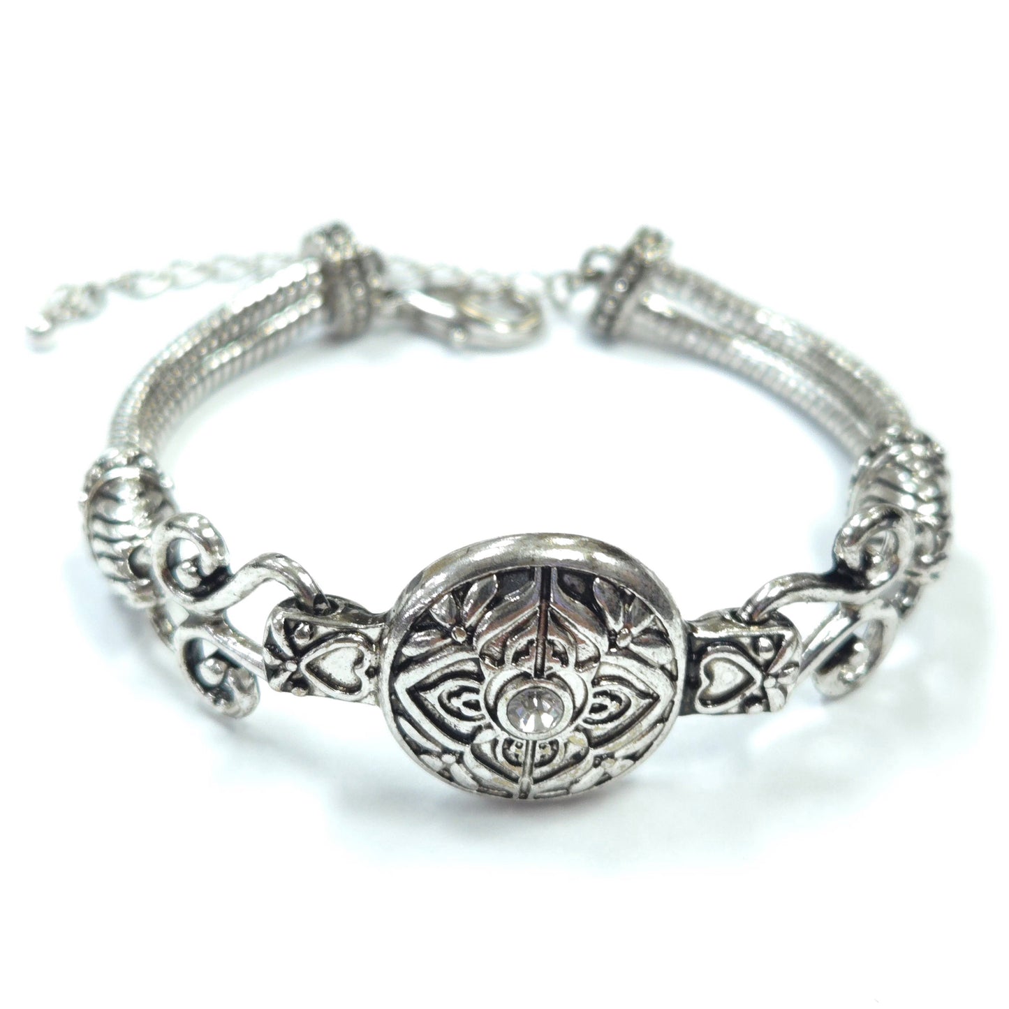 Silver bracelet with intricate design on a white background