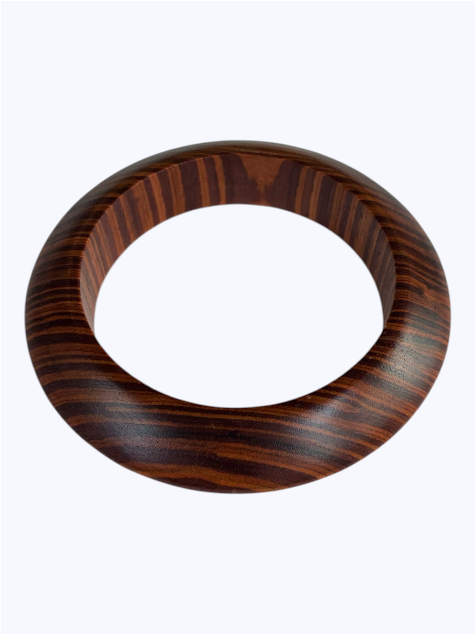 Brown wood grain oval bangle bracelet with a smooth sculpted resin design and modern minimalist style