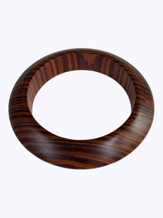Brown wood grain oval bangle bracelet with a smooth sculpted resin design and modern minimalist style
