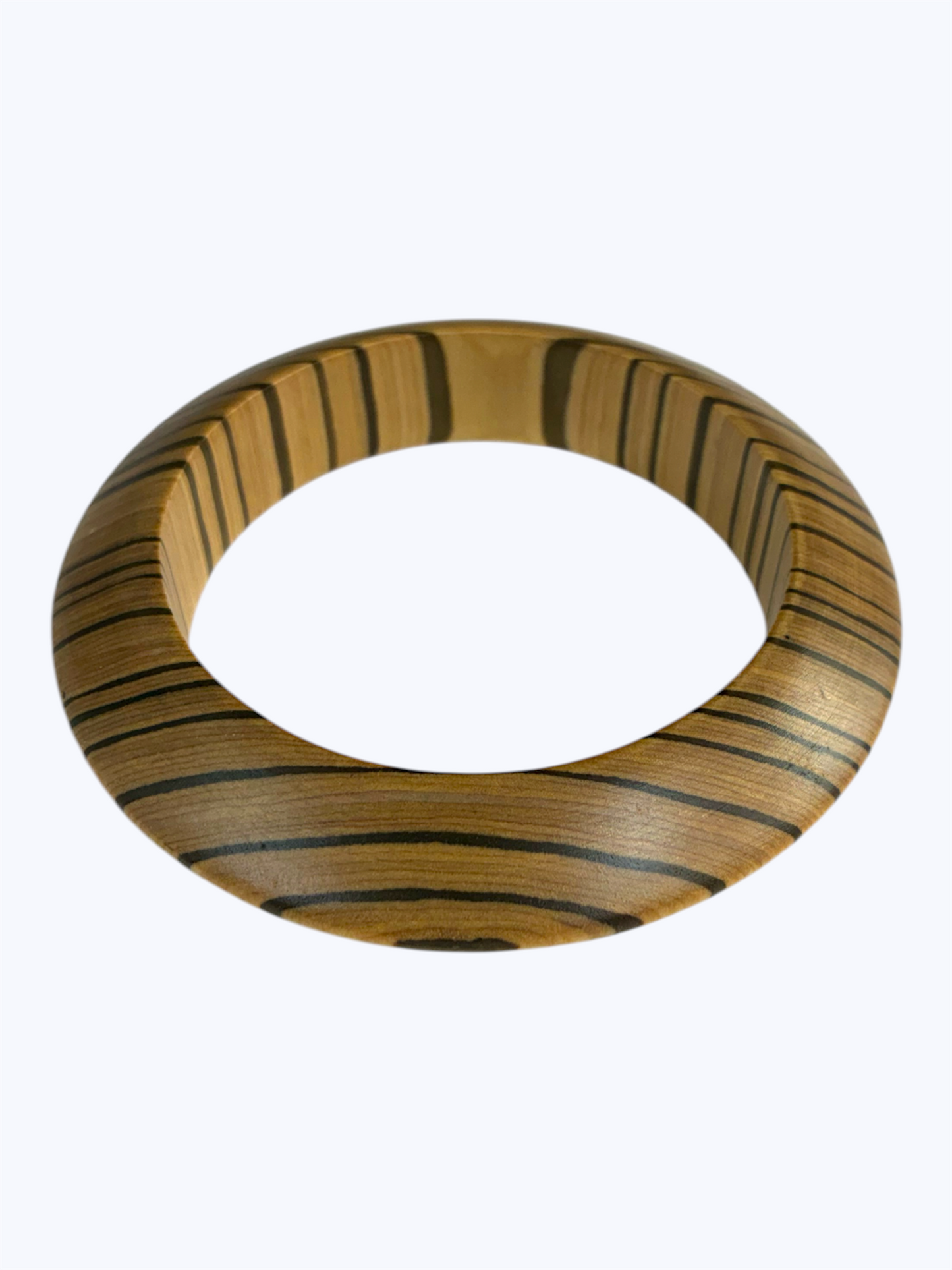 Tan striped oval bangle bracelet with a natural wood-inspired finish and contemporary sculpted silhouette