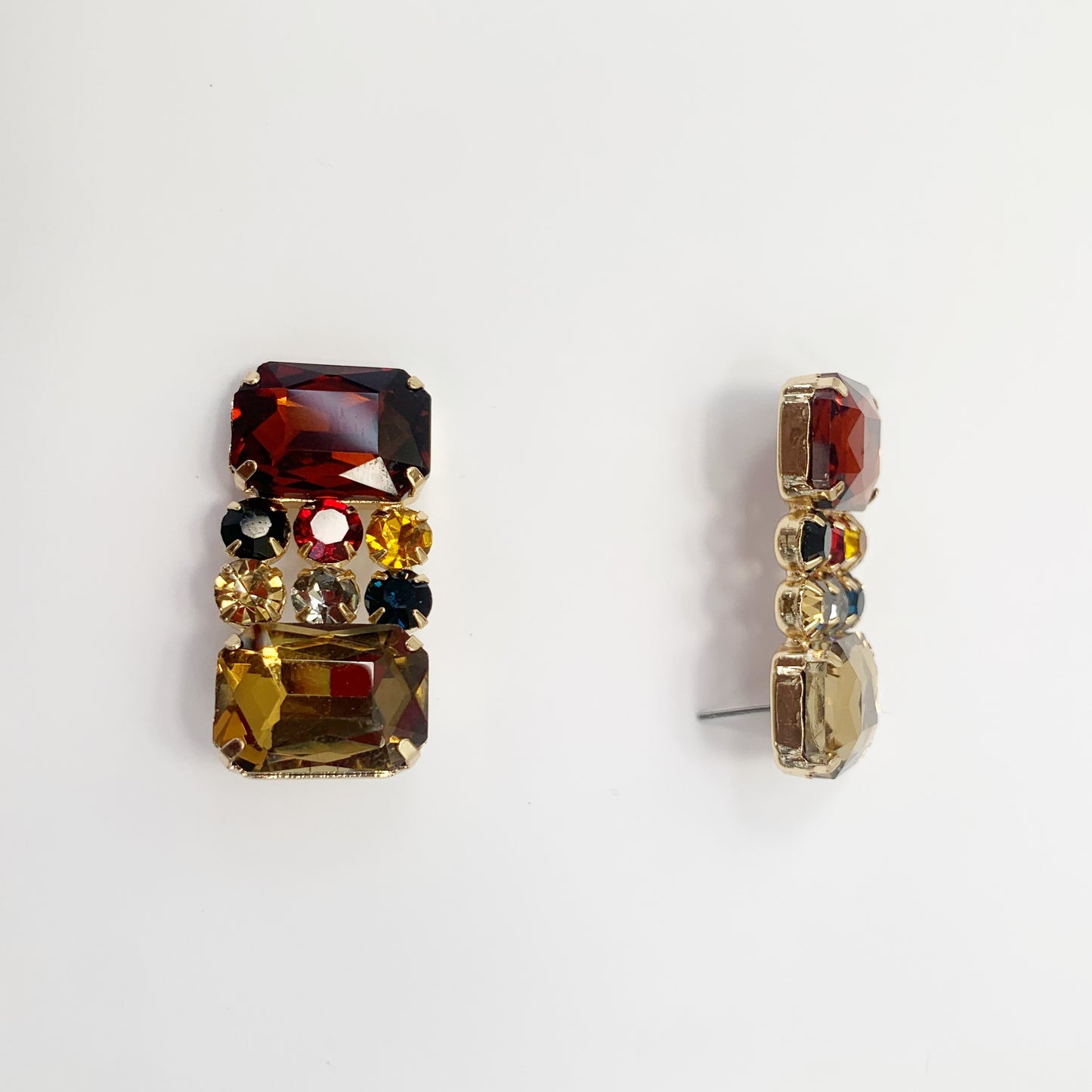 Rectangular crystal drop earrings with multicolor gemstone-inspired accents in a bold glamorous boutique style.