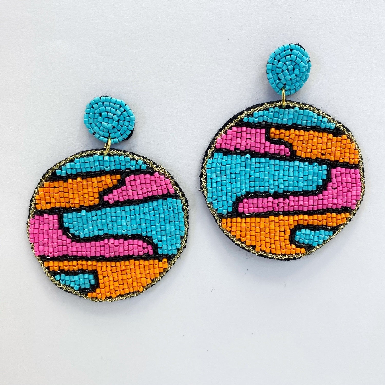 A pair of beaded earrings on a white background