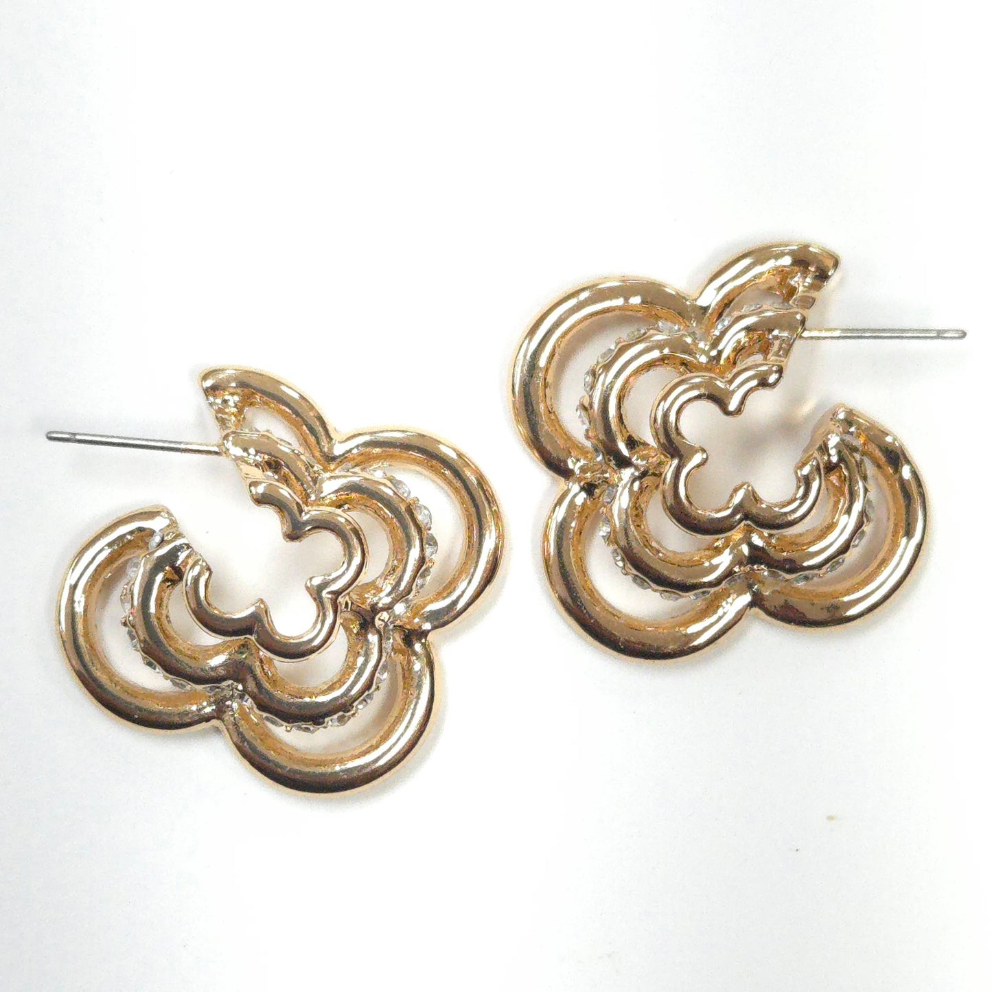 Pair of gold hoop earrings on a white background