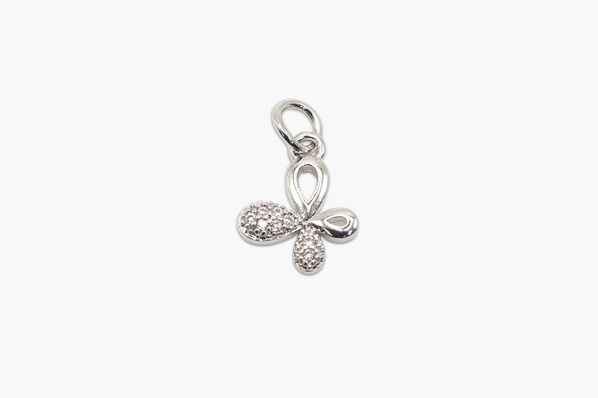 Silver bow-shaped pendant with small diamonds on a white background