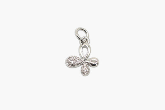 Silver bow-shaped pendant with small diamonds on a white background