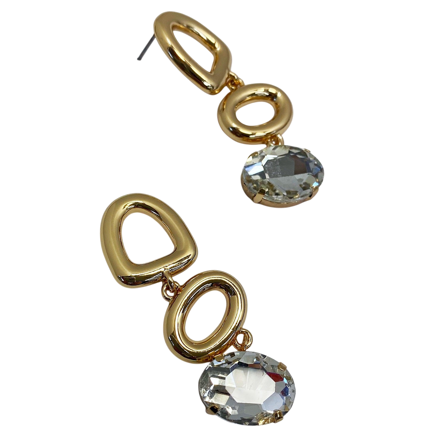 Gold earrings with clear gemstones on a white background