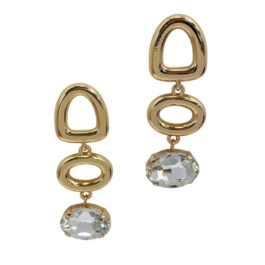 Gold earrings with clear gemstones on a white background