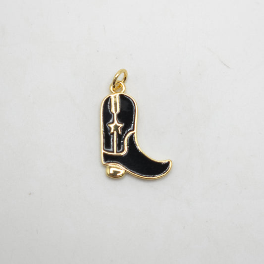 Gold and black cowboy boot charm on a white background