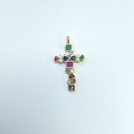 Gold cross pendant with colorful gemstones on a light gray background