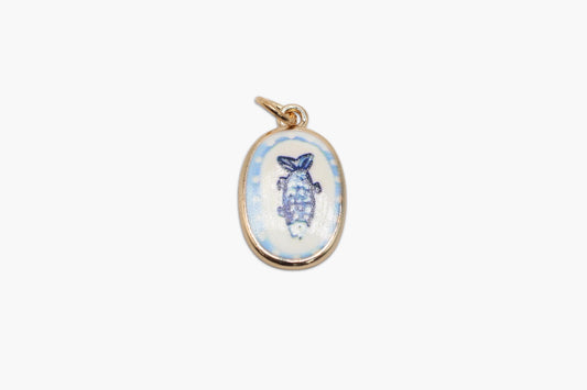 Gold pendant with a blue and white design on a white background