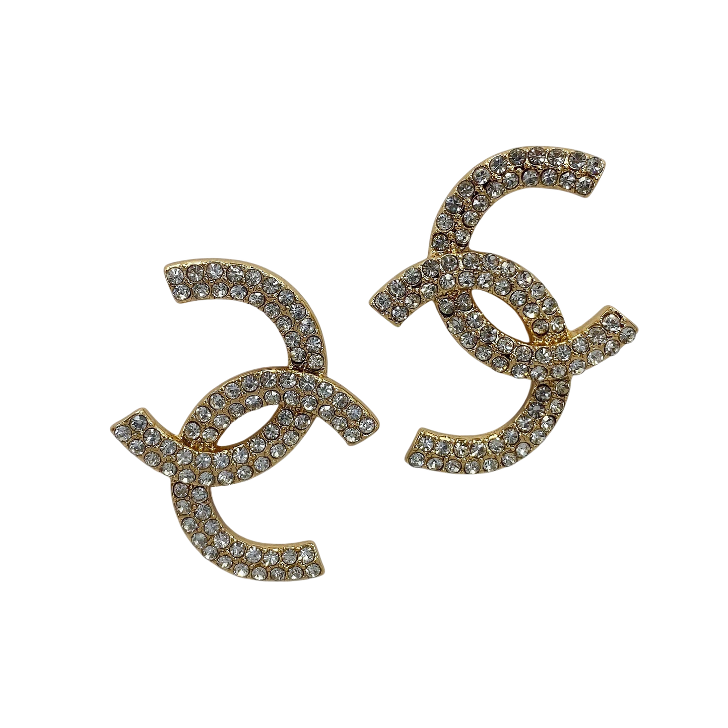 Gold earrings with rhinestone embellishments on a white background