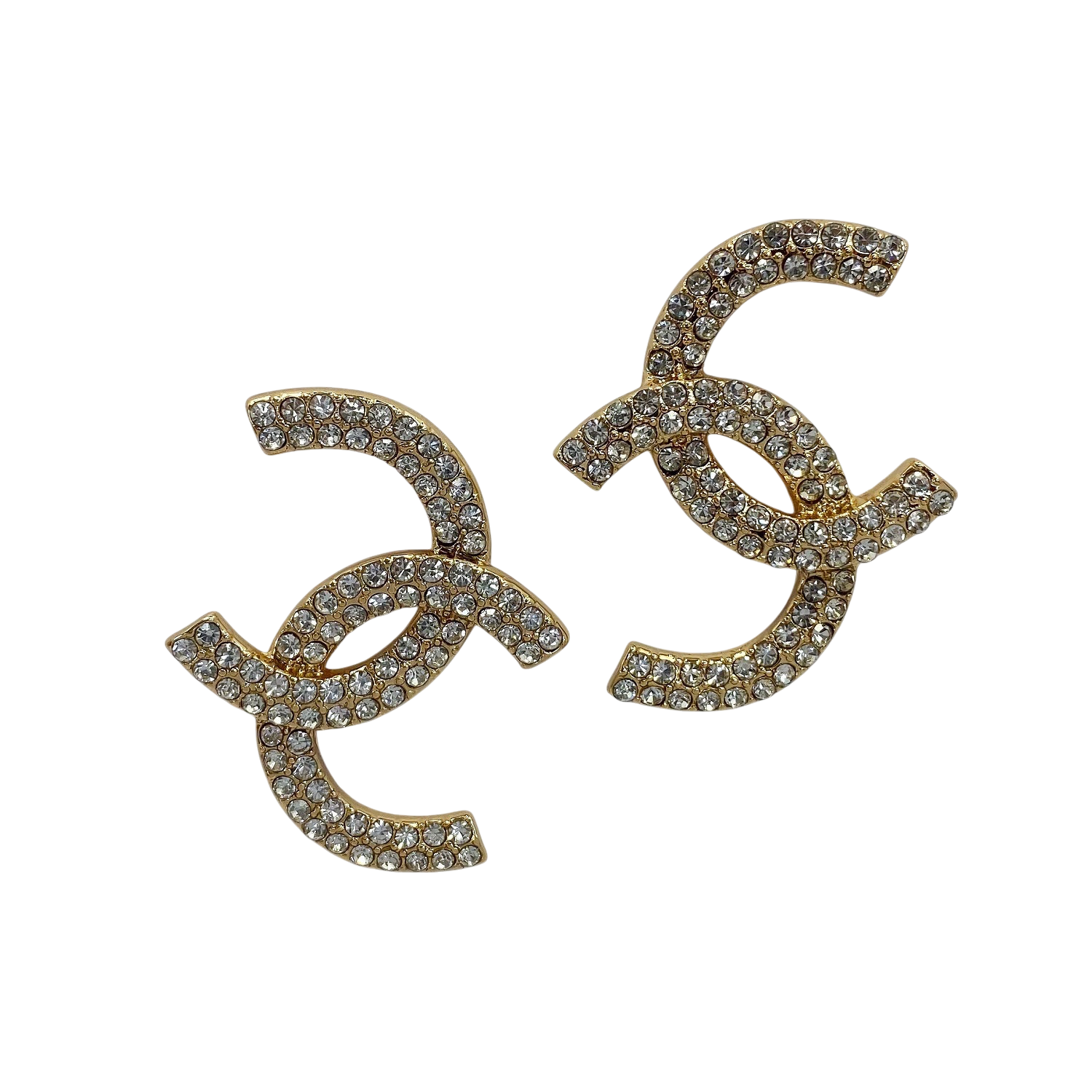 Gold earrings with rhinestone embellishments on a white background