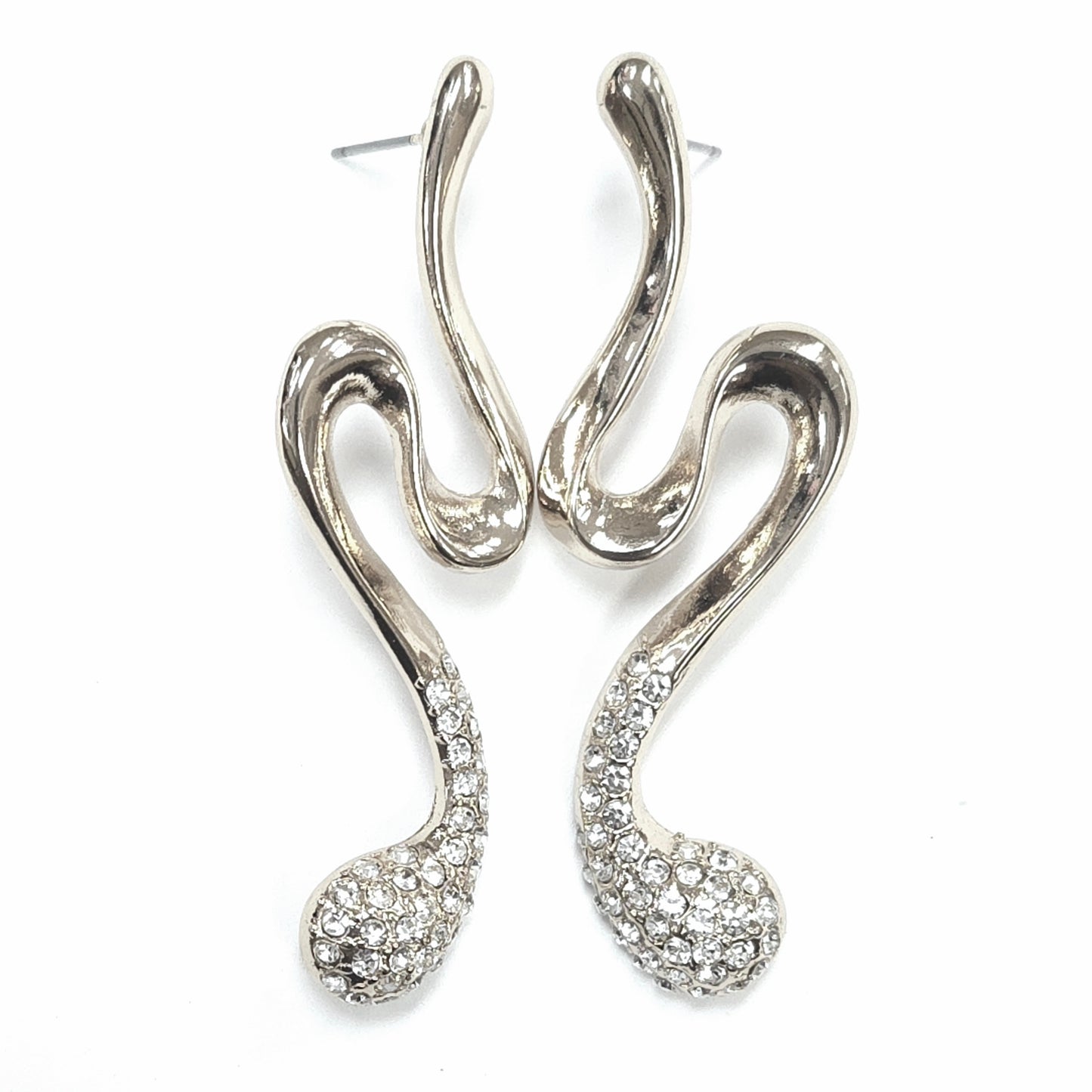 Silver earrings with intricate designs on a white background