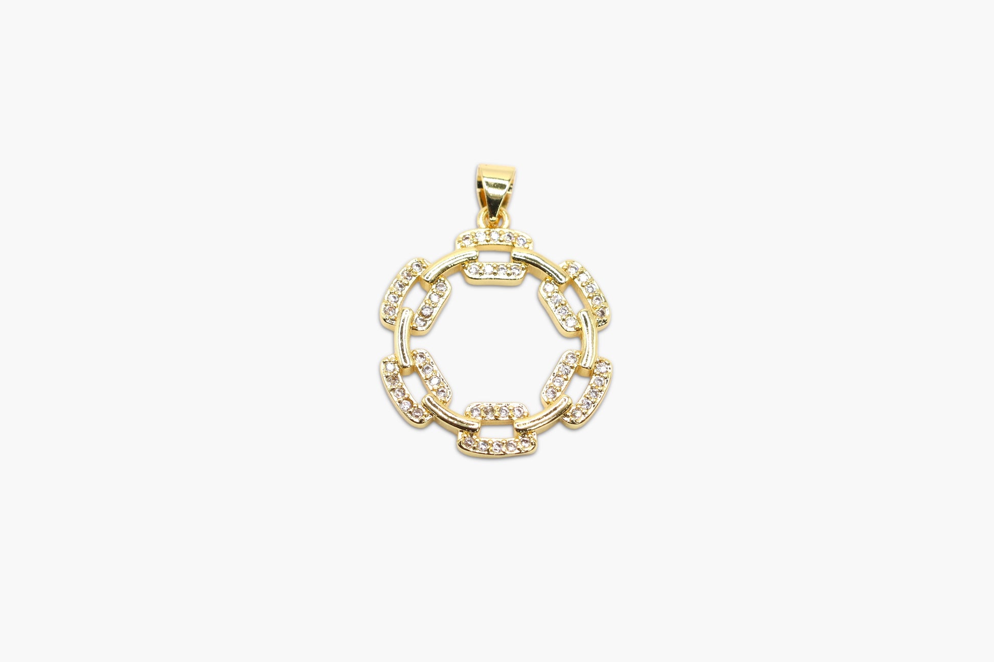Gold pendant with circular design on a white background