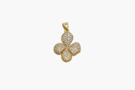 Gold four-leaf clover pendant on a white background
