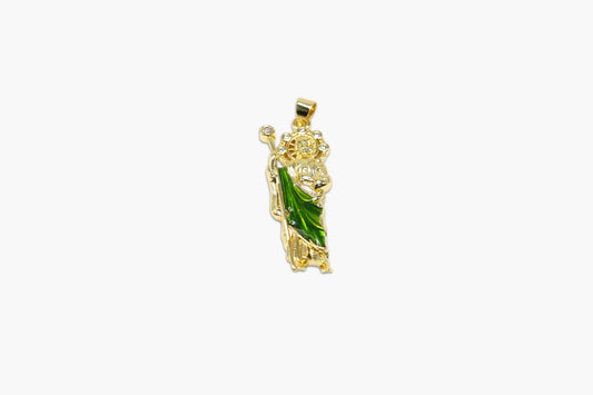 Gold pendant with green gemstone on a white background
