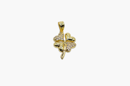 Gold four-leaf clover pendant with clear stones on a white background