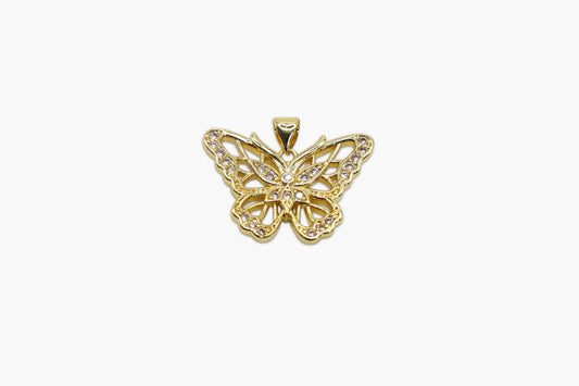 Gold butterfly pendant on a white background