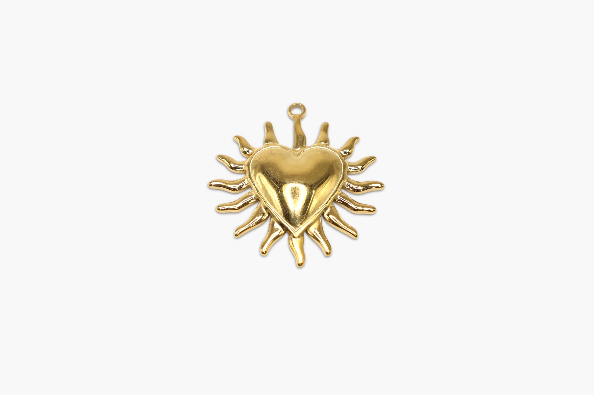 Gold heart-shaped pendant on a white background