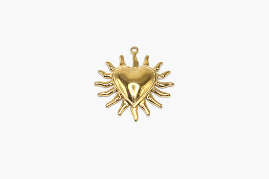 Gold heart-shaped pendant on a white background