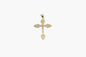 Gold cross pendant on a white background