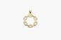 Gold pendant with circular design on a white background