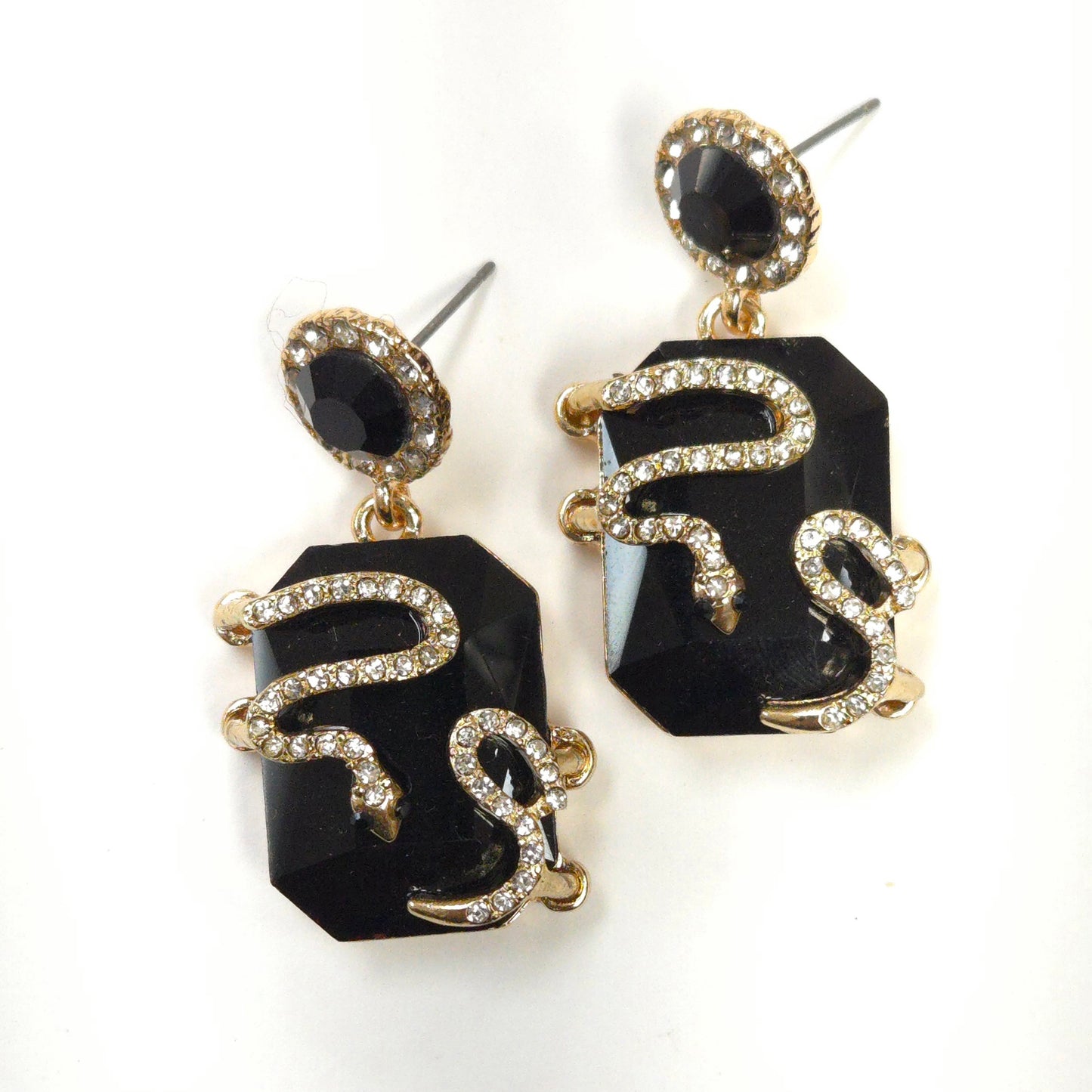 Black and gold earrings on a white background