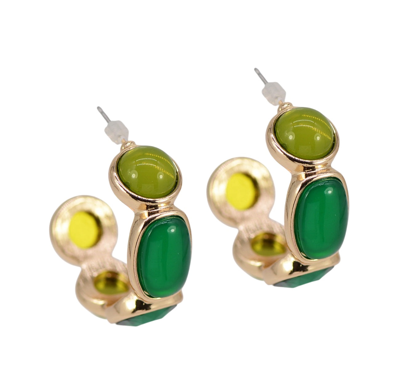 Gold earrings with green stones on a white background