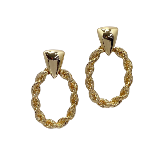 Pair of gold hoop earrings with twisted design on a white background