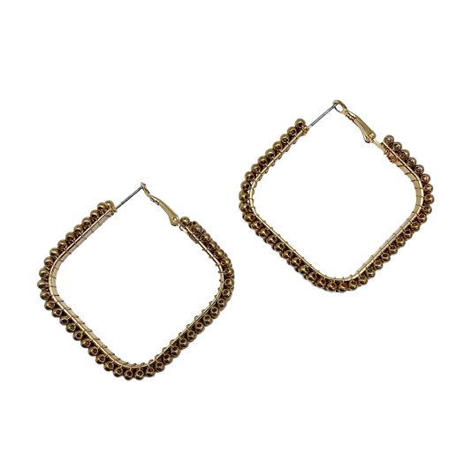 Gold hoop earrings with beaded accents on a white background