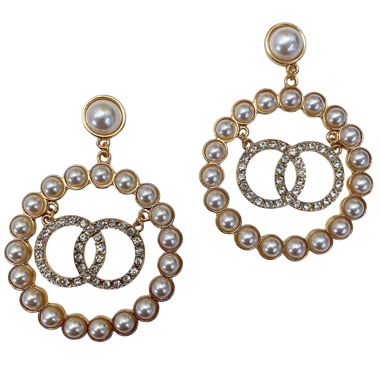 Pair of pearl and gold hoop earrings on a white background