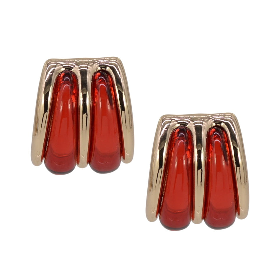 Gold drop post earrings with red gemstones on a white background