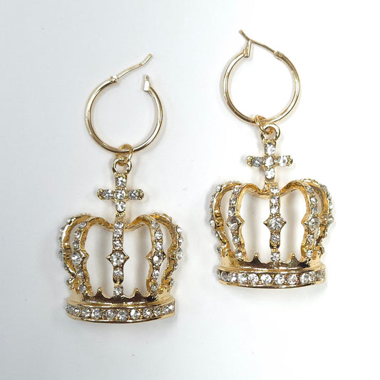 Gold crown-shaped earrings with rhinestones on a white background