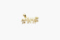 Gold pendant with 'MAMAN' inscription on a white background
