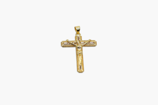Gold cross pendant on a white background