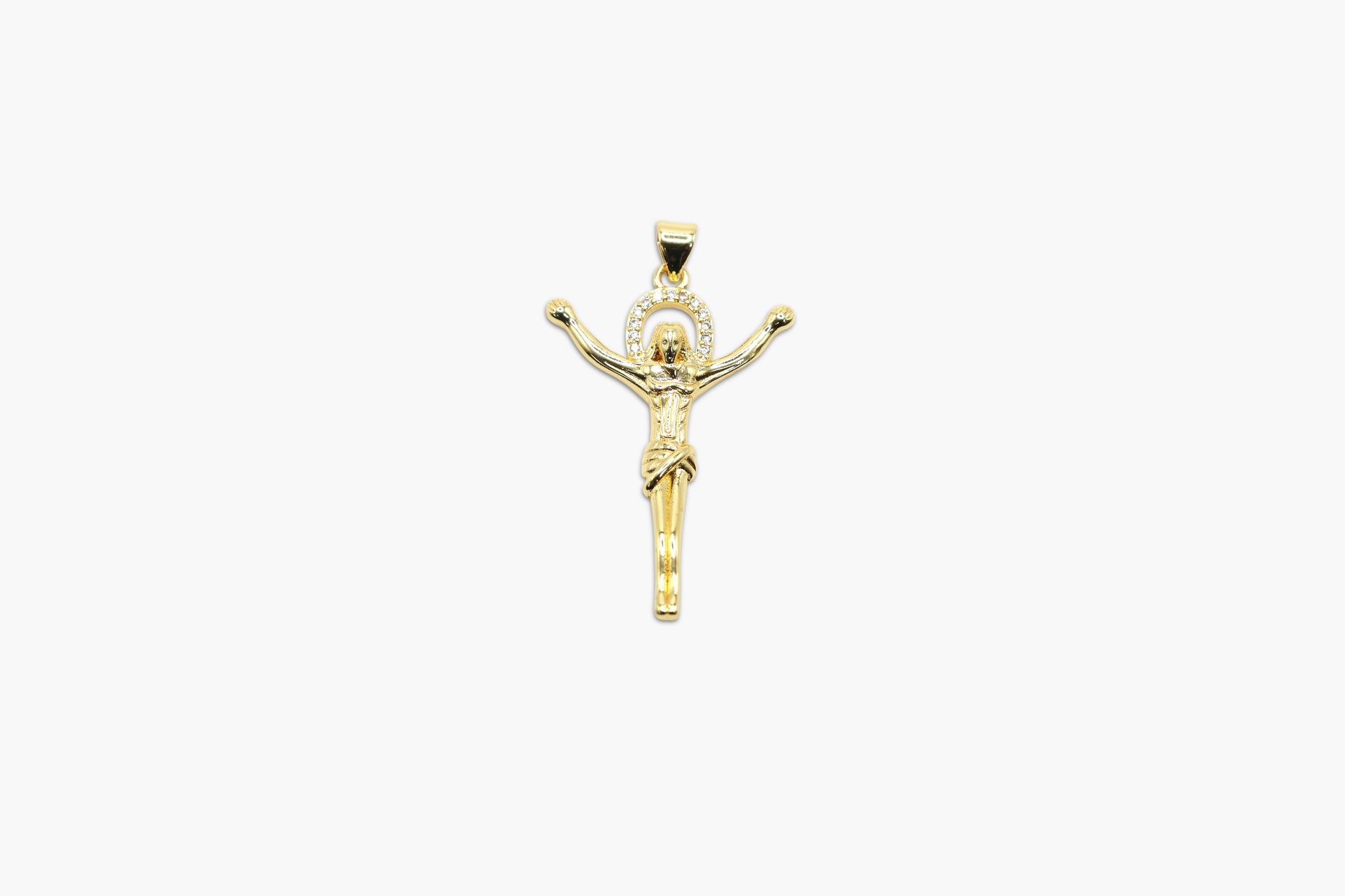 Gold crucifix pendant on a white background