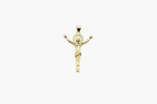 Gold crucifix pendant on a white background