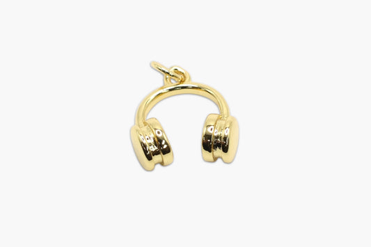 Gold headphone-shaped earring on a white background