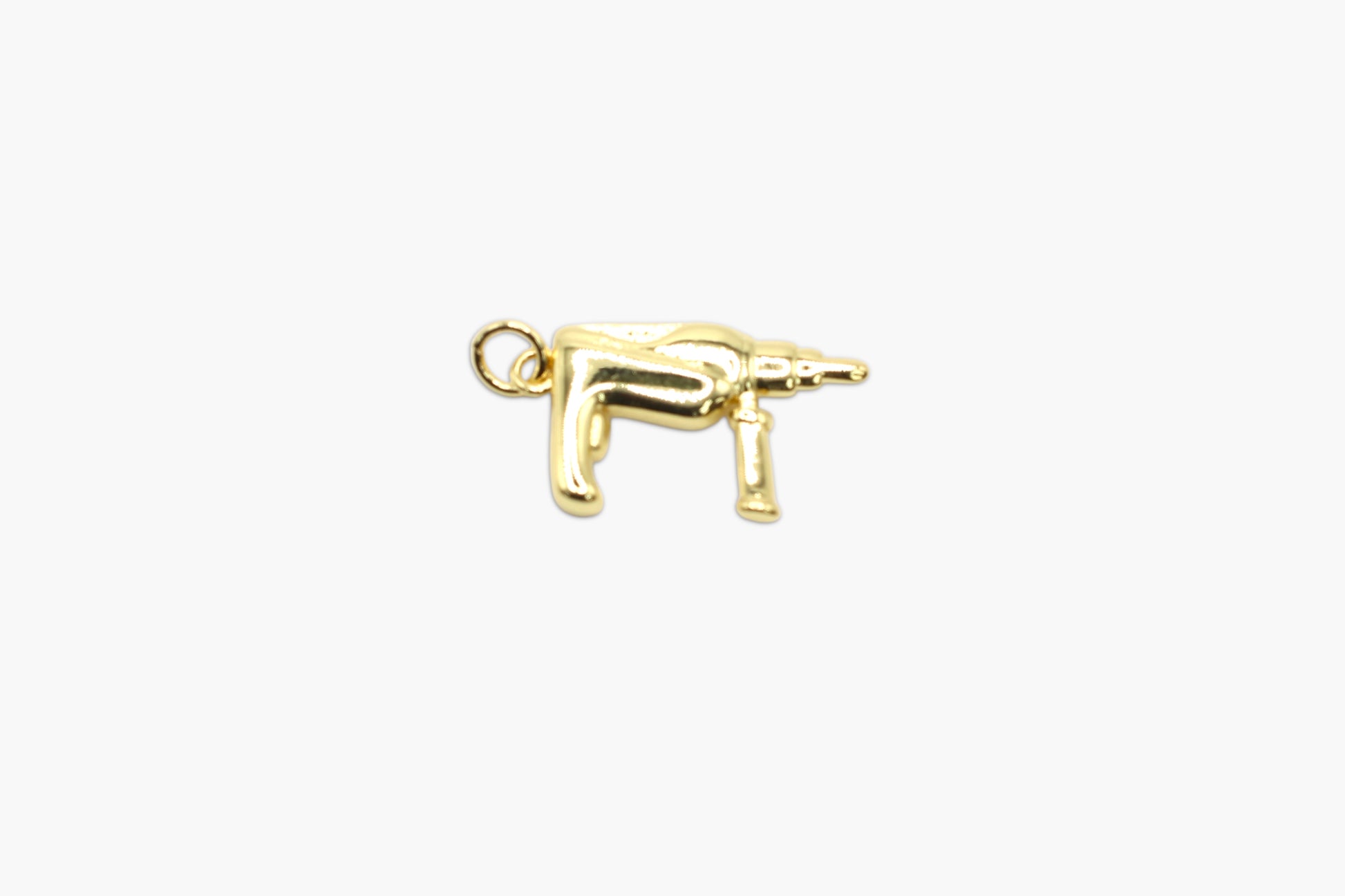 Gold dog charm on a white background