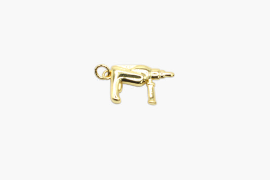 Gold dog charm on a white background