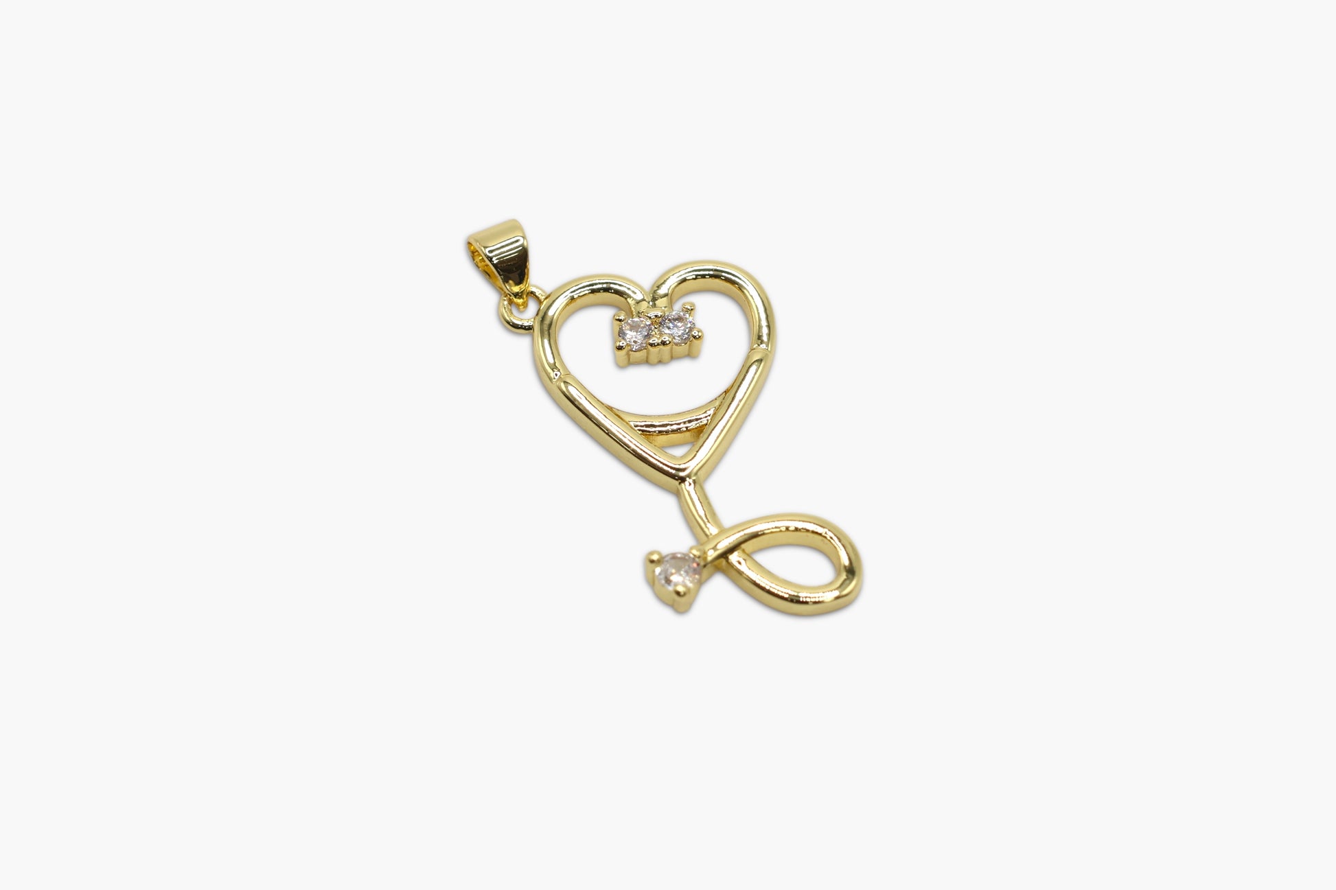 Gold heart-shaped pendant with a small diamond on a white background
