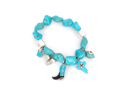 Turquoise beaded bracelet with cowboy boot charm on a white background