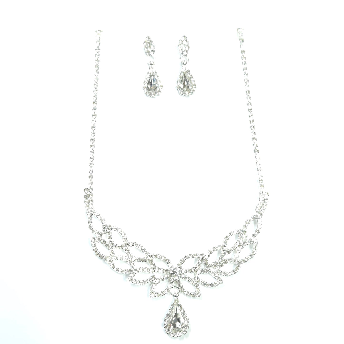 Silver necklace and earrings set on a white background