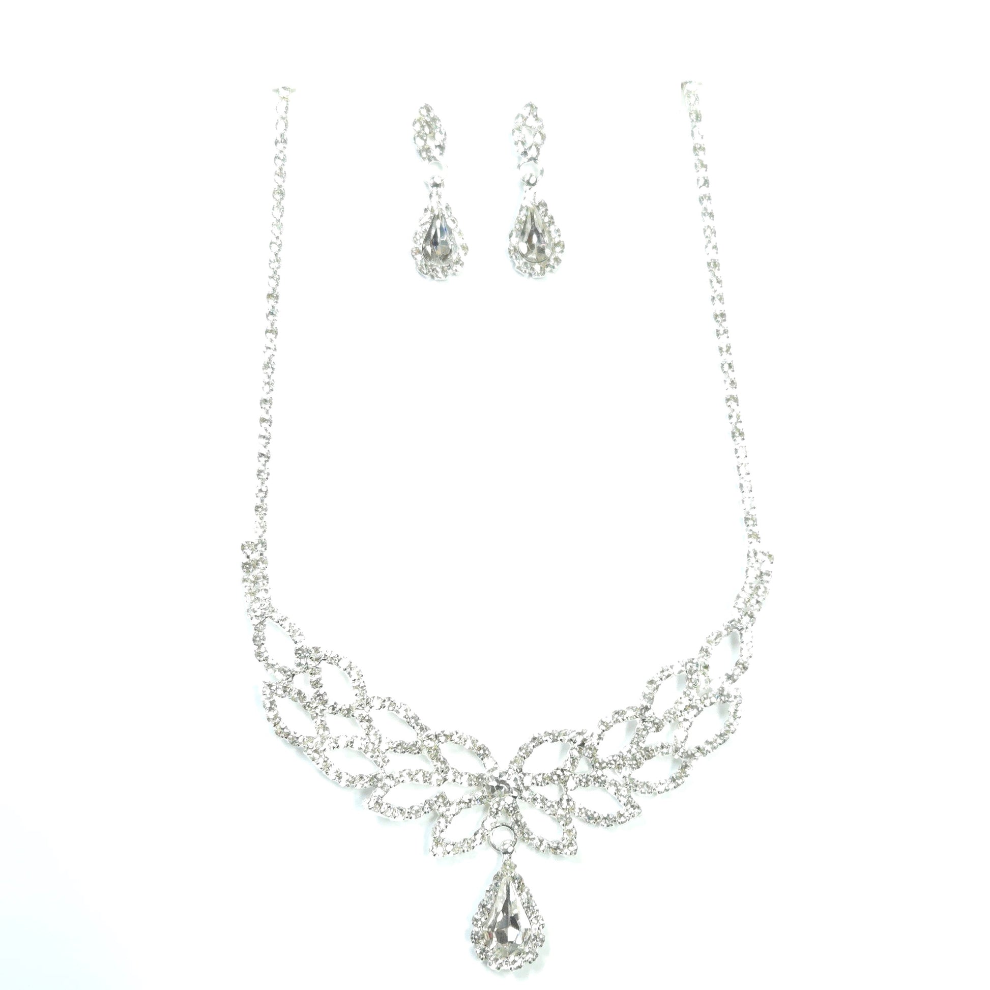 Silver necklace and earrings set on a white background