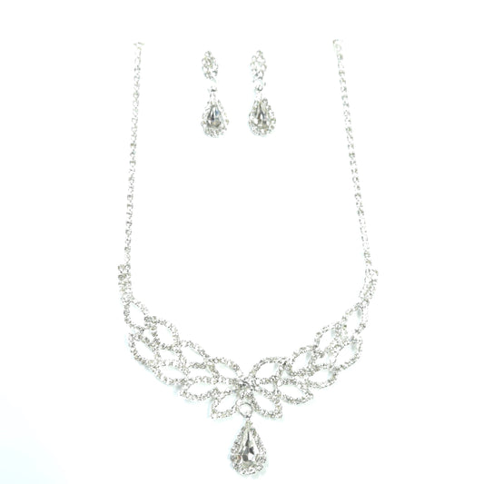 Silver necklace and earrings set on a white background