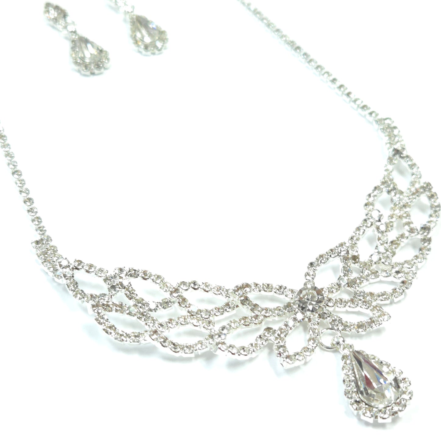 Silver jewelry set with necklace and earrings on a white background